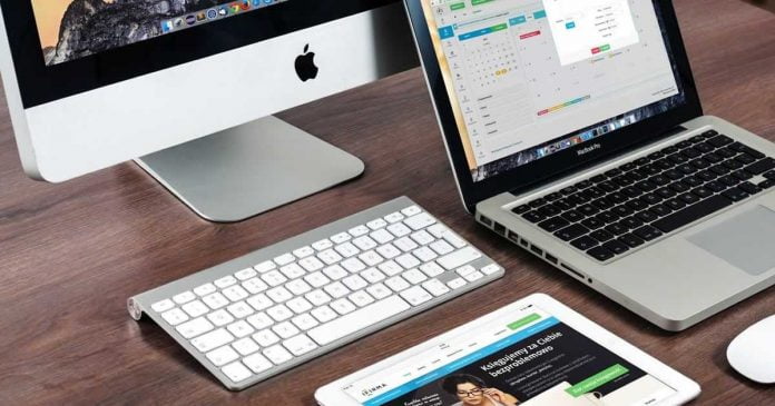 Modern IR website workstation showing iPad MacBook and Mac computer